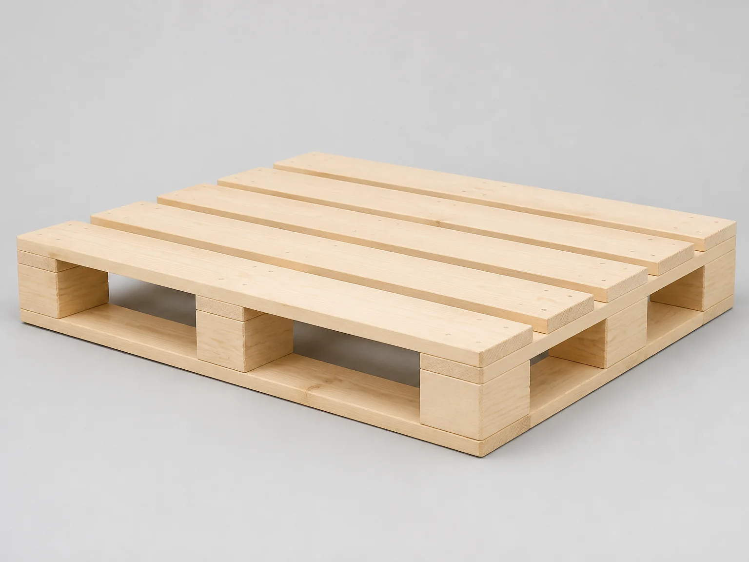 Studio image of a plain, unmarked four-way-entry timber pallet of the type supplied for export use
