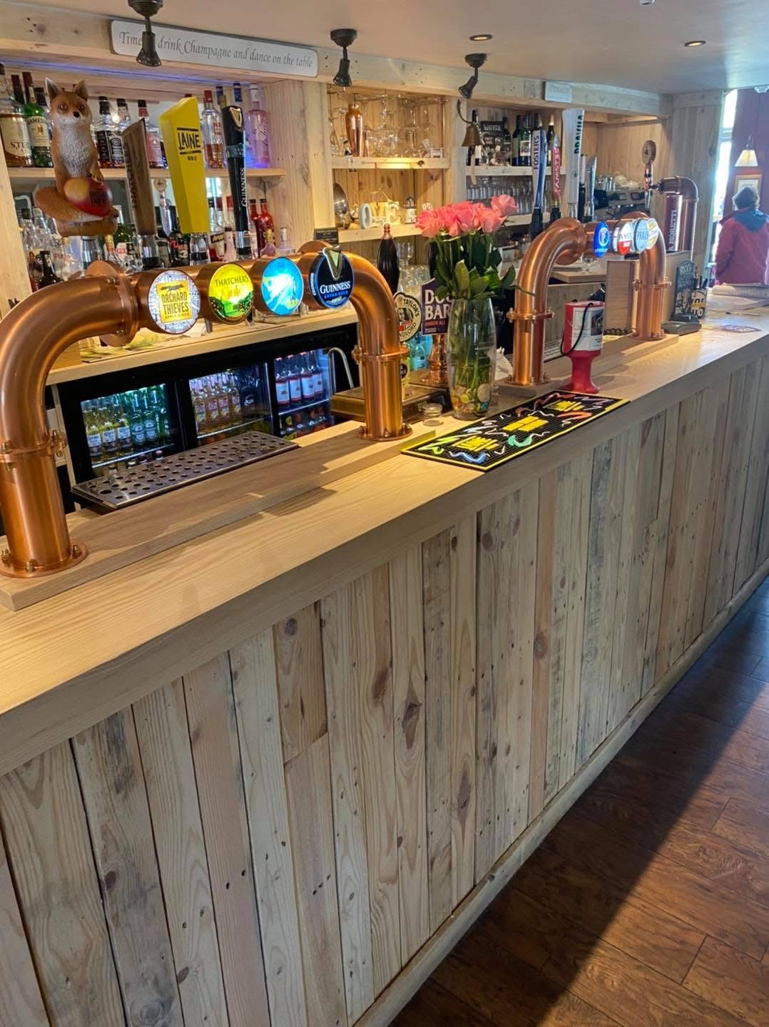 Finished Hayling Island pub bar showing reclaimed pallet boards used as timber cladding